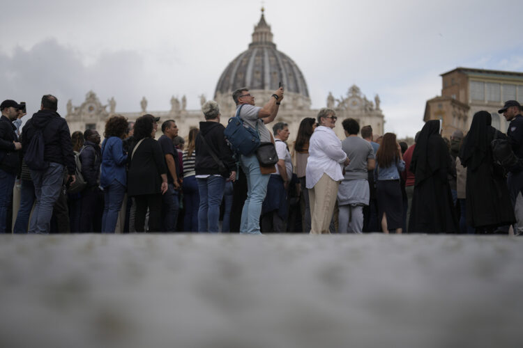 A young nun says goodbye to Francis after hours in line with thousands of faithful